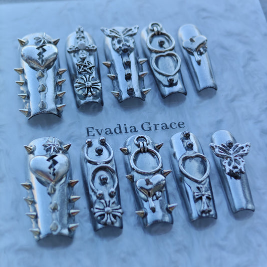 Silver Armor Nails – Spiked Chrome Press-On Nails with Heart, Cross & Butterfly Accents | Cyber Gothic Punk Design by Evadia Grace