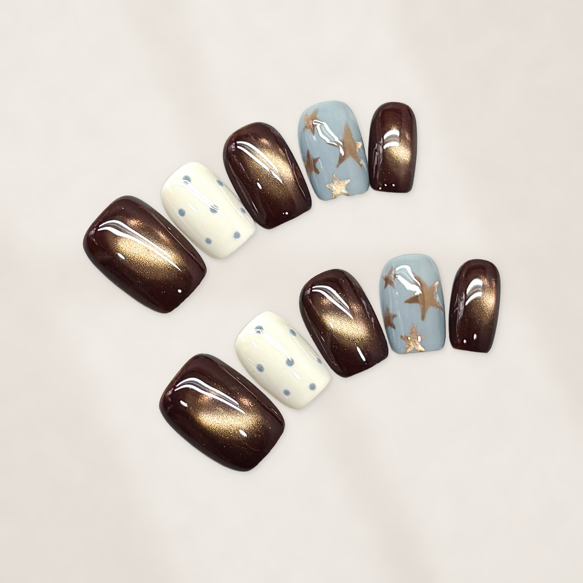 Autumn Cocoa Starfall Short Squoval Press-On Nails with Bronze Cat-Eye Glow, Blue Starbursts, and Glossy Cream Dots 16mm