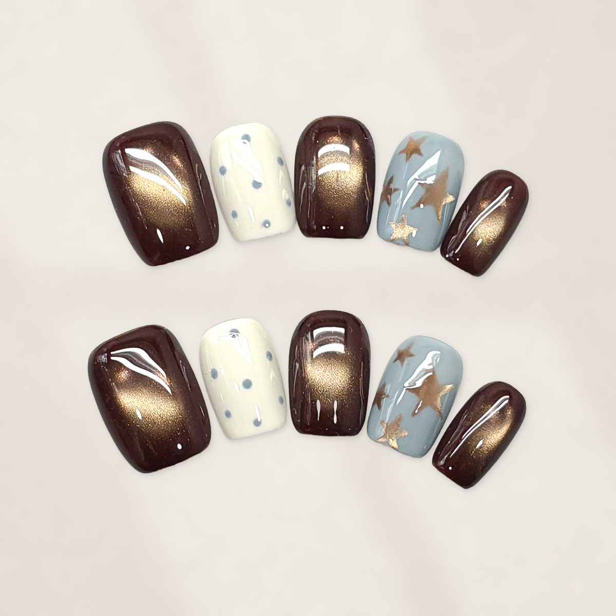 Autumn Cocoa Starfall Short Squoval Press-On Nails with Bronze Cat-Eye Glow, Blue Starbursts, and Glossy Cream Dots 16mm