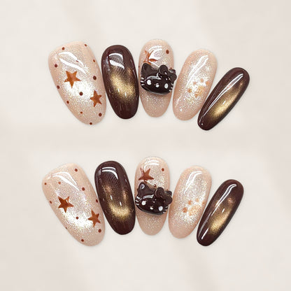 Cocoa Kitty Constellation: Short Squoval Press-On Nails with Nude Glitter, Bronze Stars, and Glossy Cat-Eye Chocolate Accents 20mm