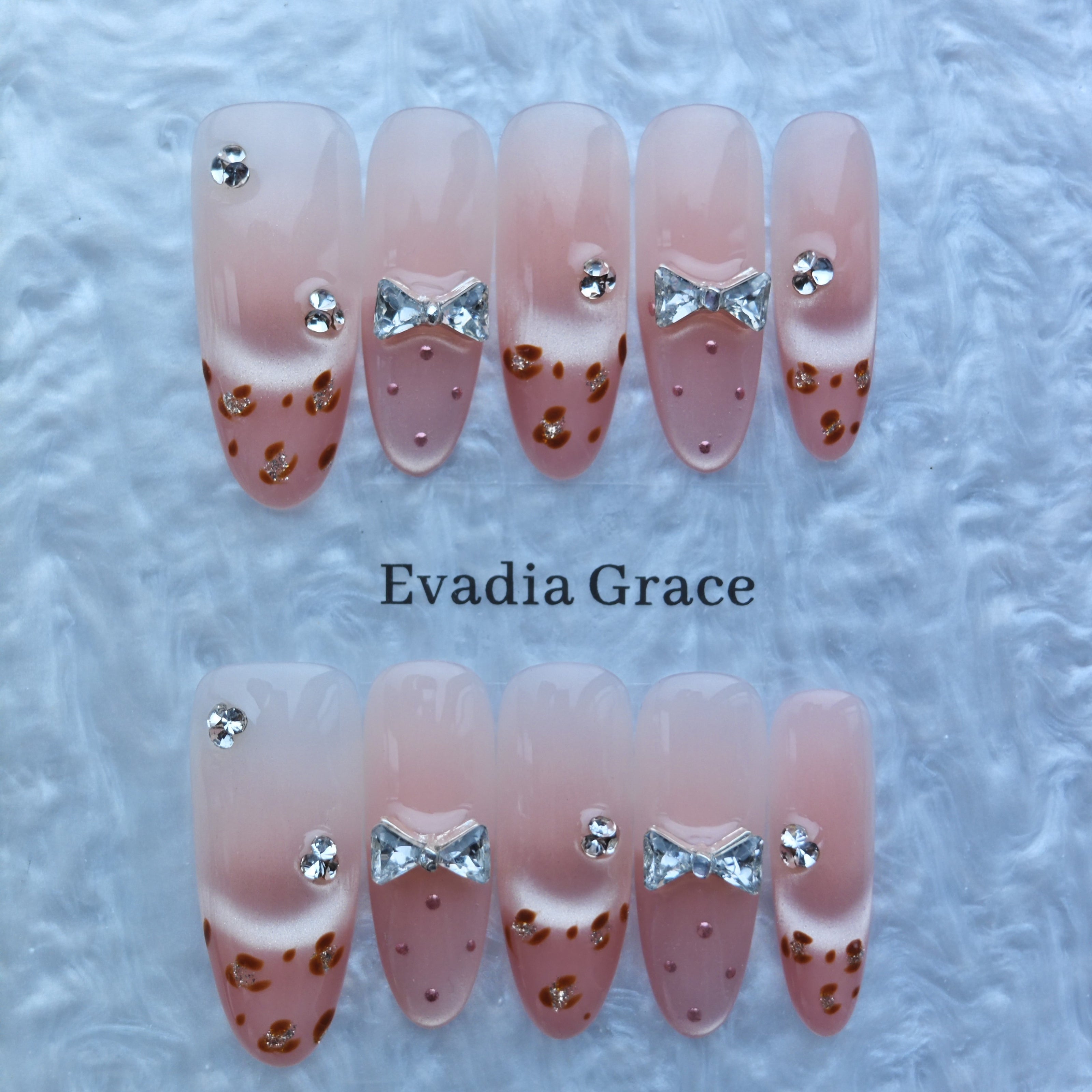 Cute Pink Gradient Press-On Nails with Faux Rhinestone Bows & Leopard Detail