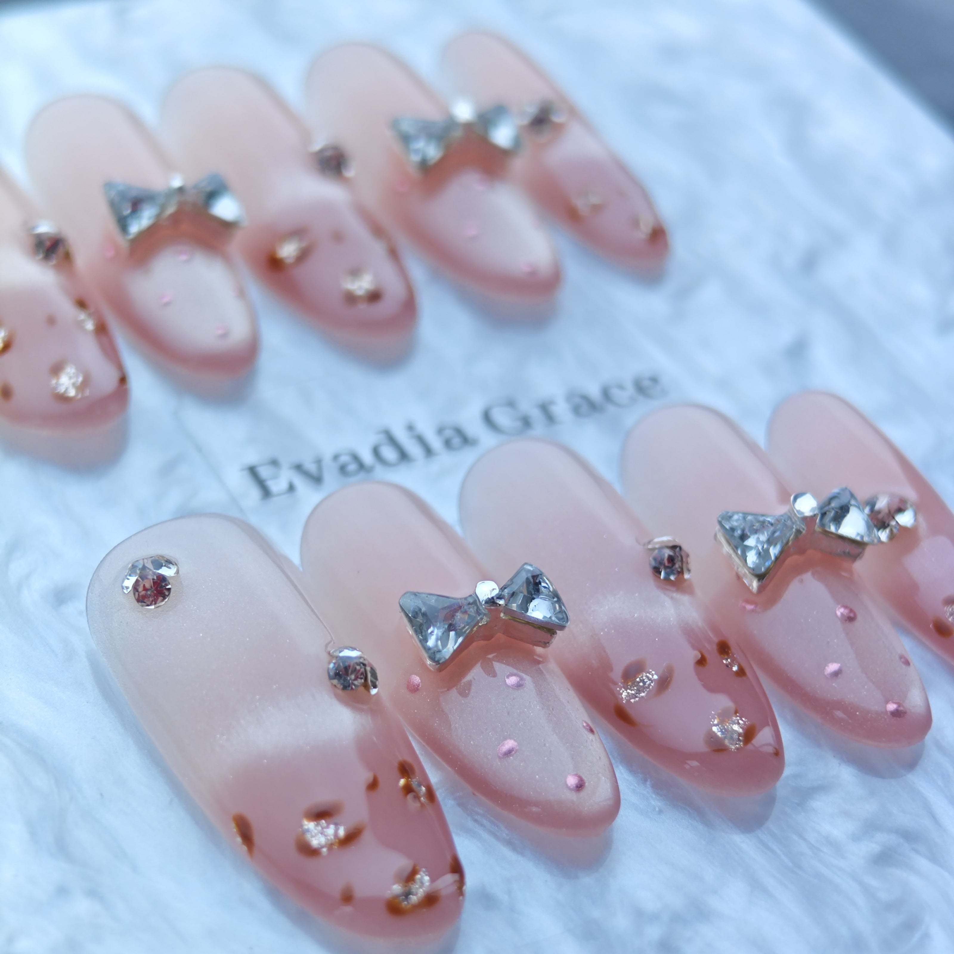 Cute Pink Gradient Press-On Nails with Faux Rhinestone Bows & Leopard Detail