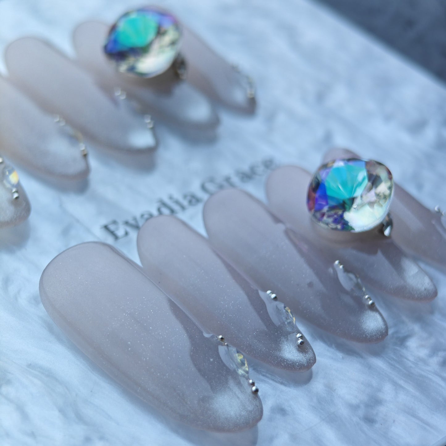 Iridescent Nude Press-On Nails with Oversized Crystal Accent & Aurora Gems