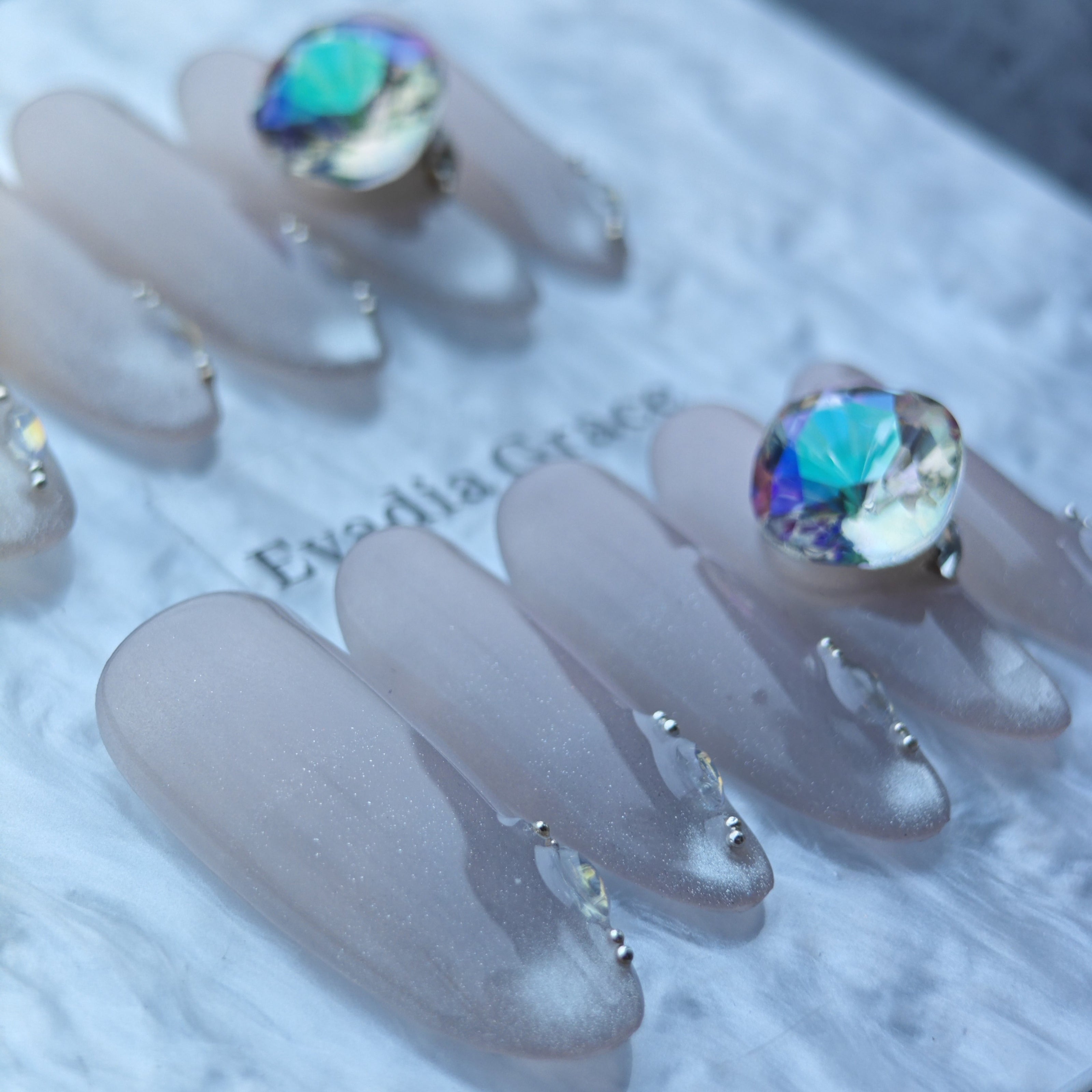 Iridescent Nude Press-On Nails with Oversized Crystal Accent & Aurora Gems