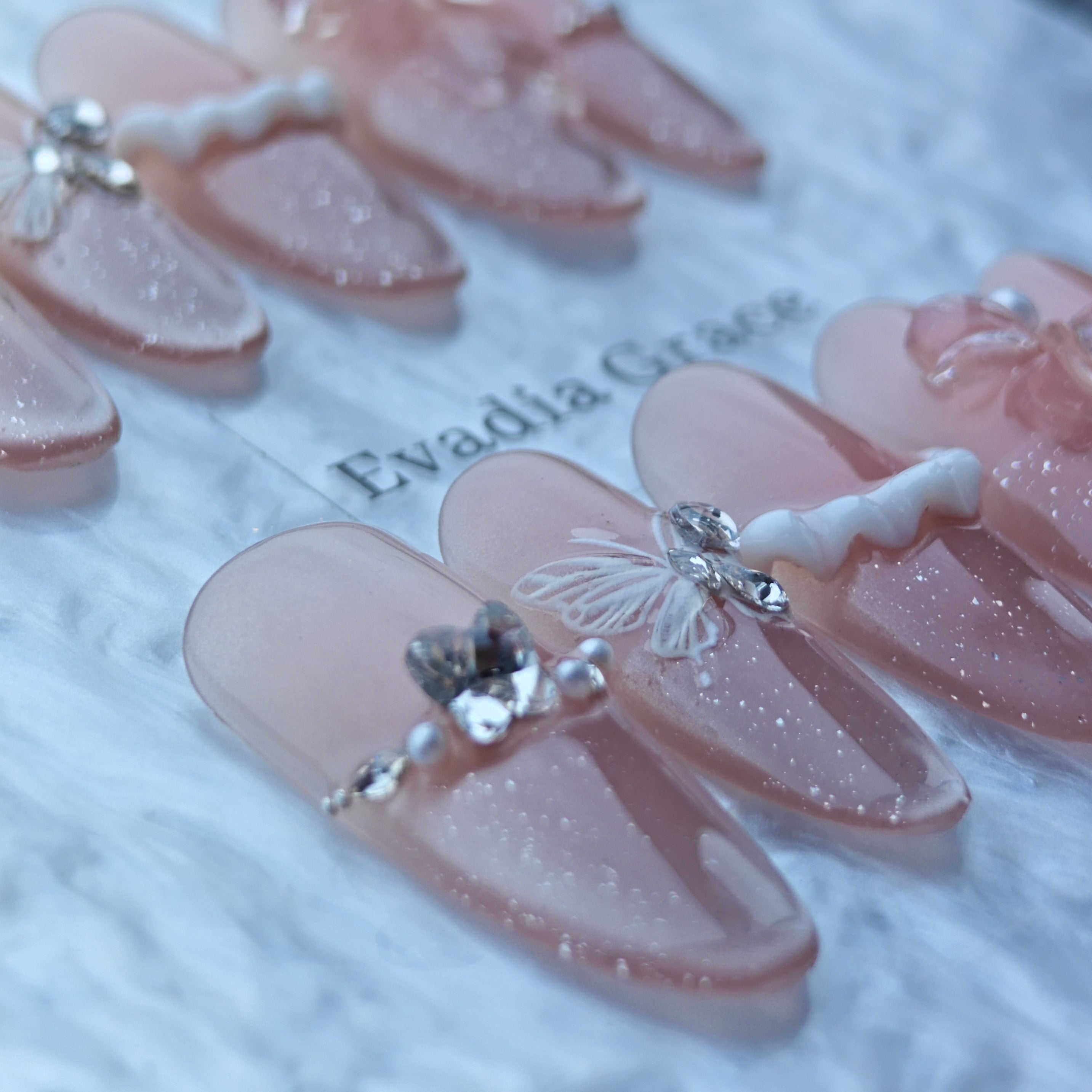 Blush Pink Glitter Press-On Nails with Butterfly, Bow & Pearl Accents