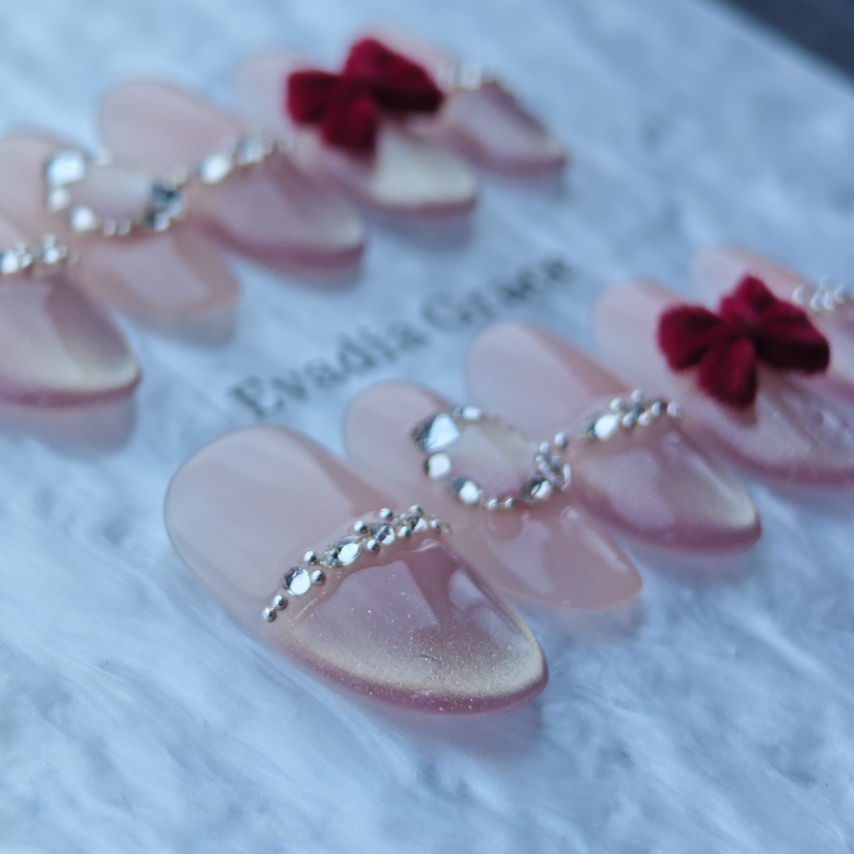 Red Velvet Bow Press-On Nails with Rhinestone Bands & Nude Pink Base