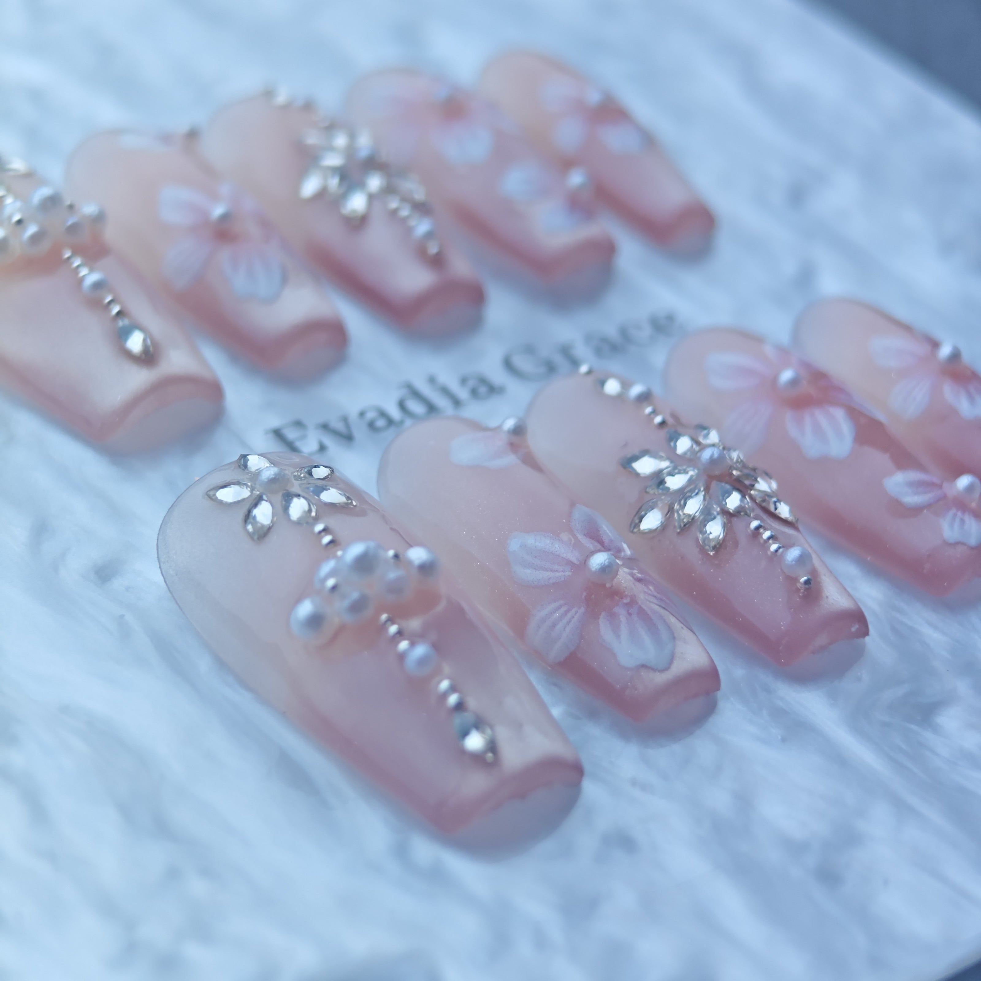 Blush Pink Press-On Nails with Hand-Painted Flowers & Rhinestone Cross Accents