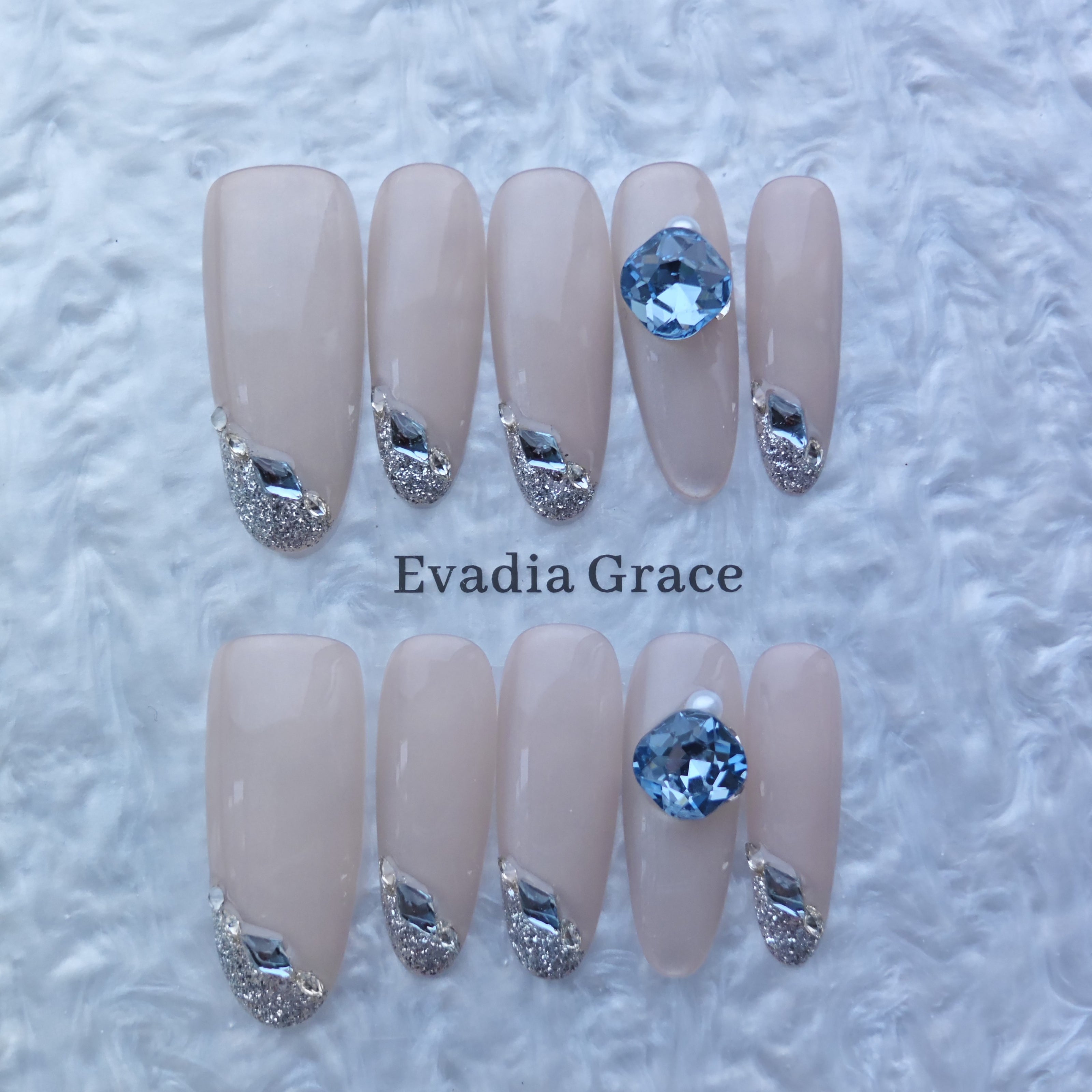 Elegant Nude Press-On Nails with Silver Glitter & Blue Gem Accents