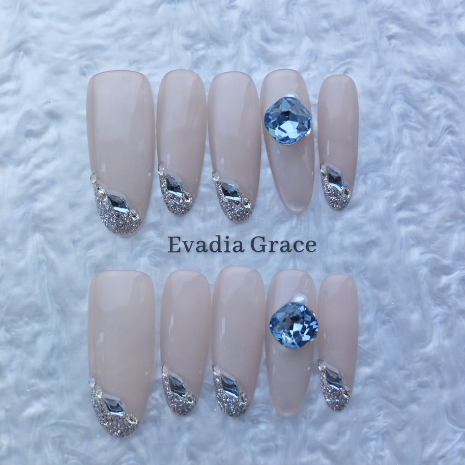Elegant Nude Press-On Nails with Silver Glitter & Blue Gem Accents