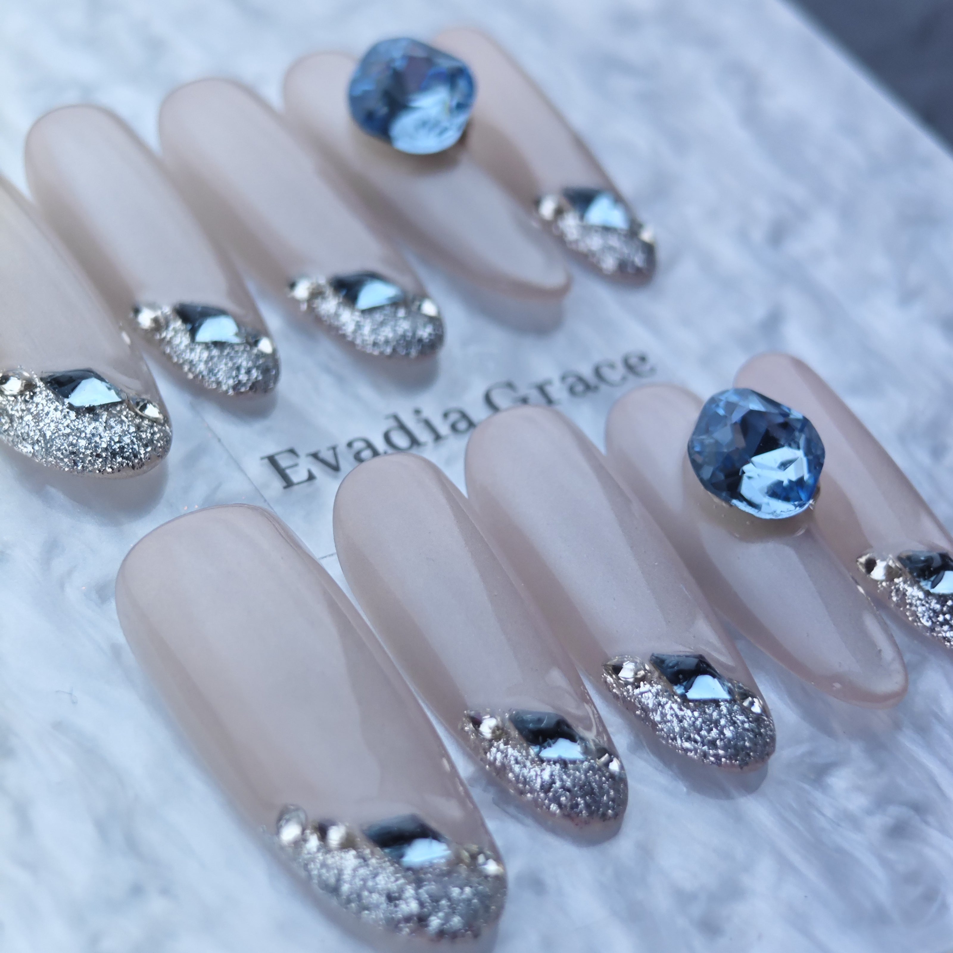 Elegant Nude Press-On Nails with Silver Glitter & Blue Gem Accents