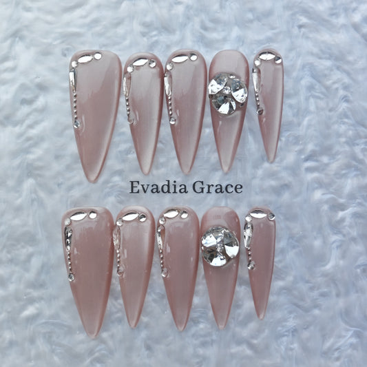 Nude Chrome Drip Nails – Silver Liquid Metal Accent with Crystal Gem