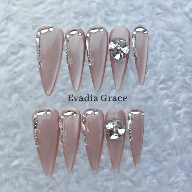 Nude Chrome Drip Nails – Silver Liquid Metal Accent with Crystal Gem