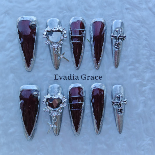 Garnet Chrome Gothic Nails – Metallic Silver Frame with 3D Cross & Heart Charm | Luxury Press-On Nails by Evadia Grace