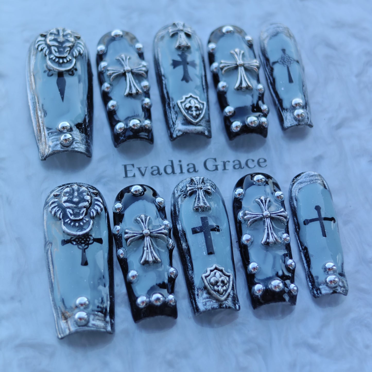 Frosted Gothic Crest Nails – Ice Blue Chrome with 3D Crosses, Lion Emblem & Shield Accents | Luxury Press-On Nails