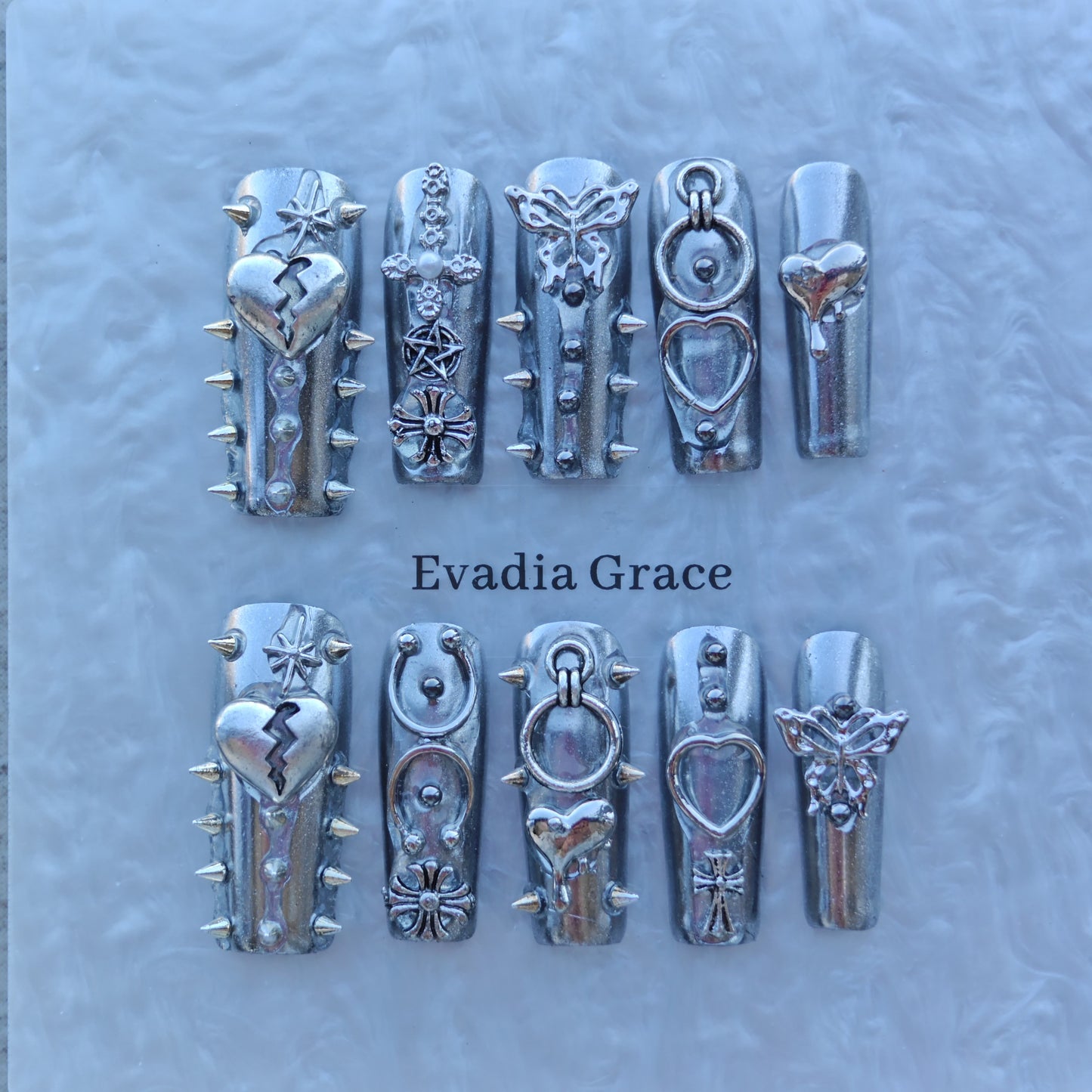 Silver Armor Nails – Spiked Chrome Press-On Nails with Heart, Cross & Butterfly Accents | Cyber Gothic Punk Design by Evadia Grace
