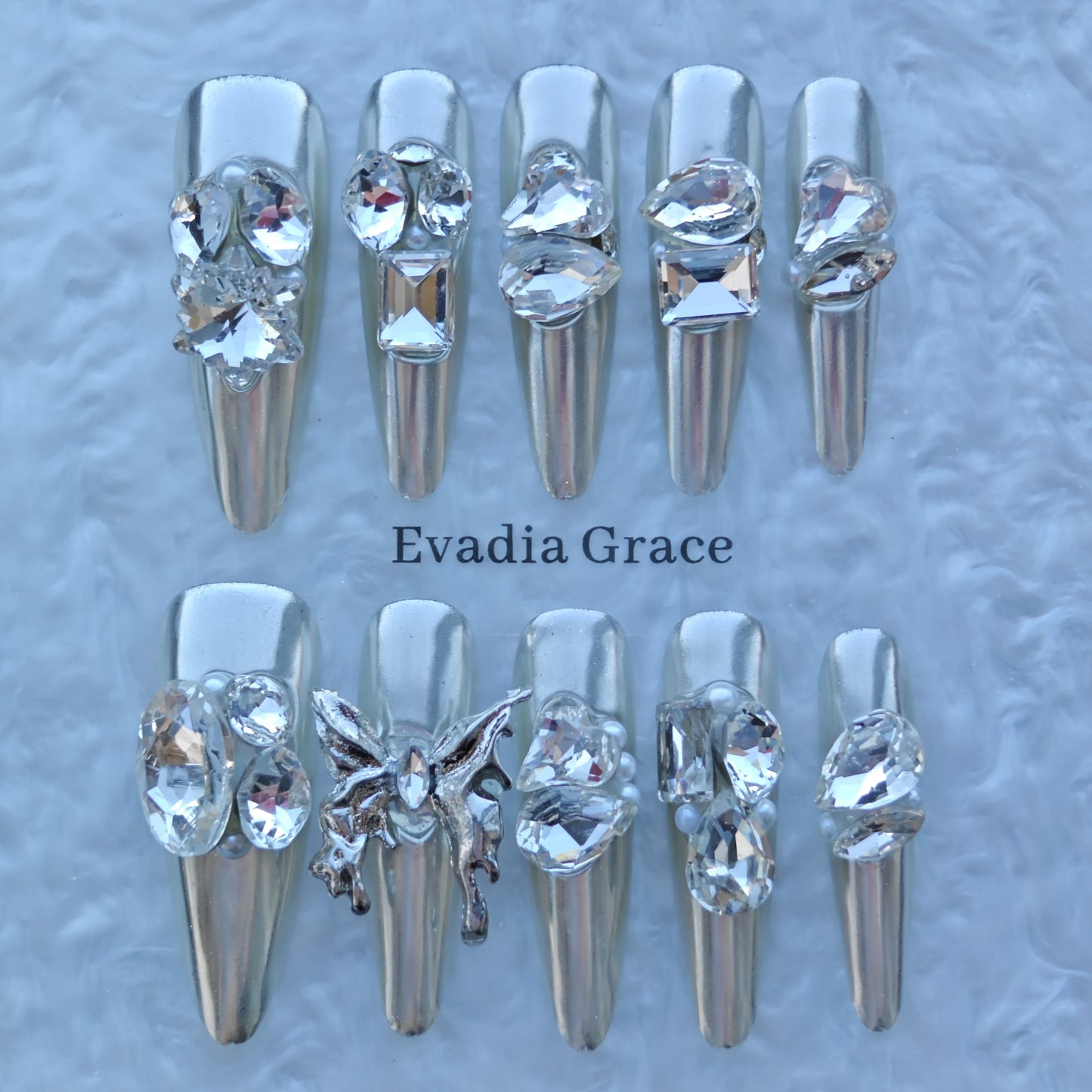 Silver Seraph Nails – Chrome Silver Crystal Press-On Nails with Butterfly & Rhinestone Accents | Luxury Gothic Fairy Nails by Evadia Grace