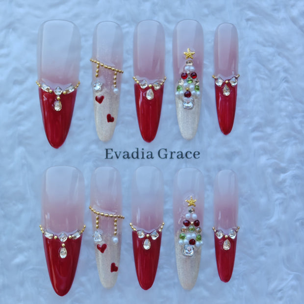 Crimson Noel Nails – Red French Tip Press-On Nails with Christmas Tree Gem & Gold Chain Details | Luxury Holiday Nails by Evadia Grace