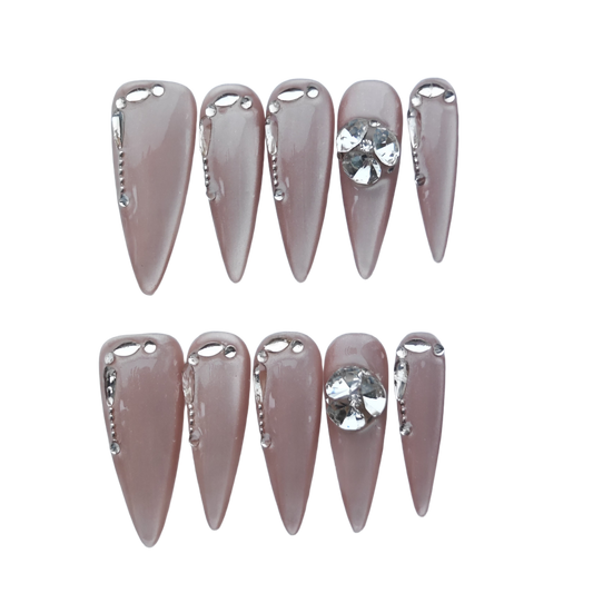 Nude Chrome Drip Nails – Silver Liquid Metal Accent with Crystal Gem