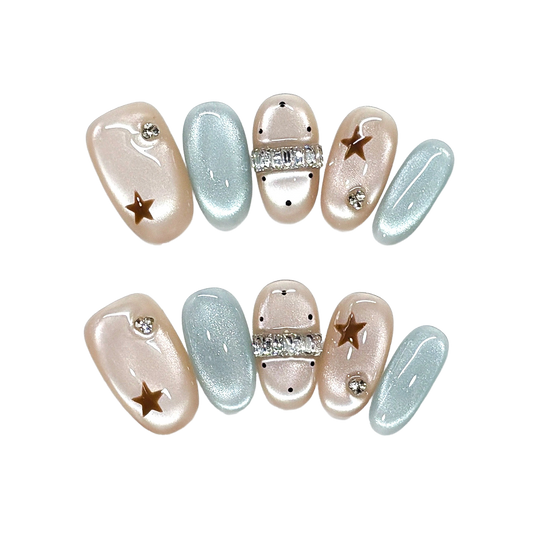 Celestial Champagne and Ice Blue Oval Press-On Nails with Crystal Bands and Golden Stars 20mm