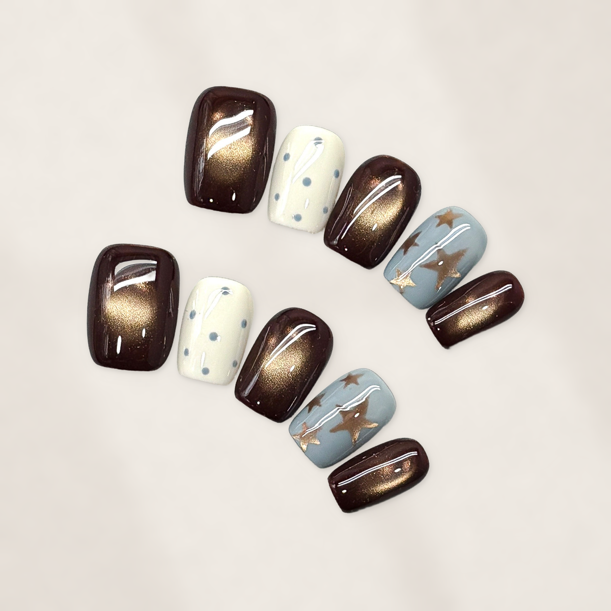 Autumn Cocoa Starfall Short Squoval Press-On Nails with Bronze Cat-Eye Glow, Blue Starbursts, and Glossy Cream Dots 16mm